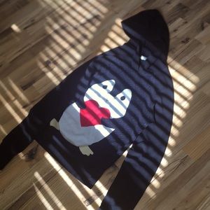 Hi I am selling a penguin sweater no holes or stand really cute